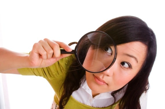 Girl Looking Through a Magnifying Glass - Photo courtesy of ©iStockphoto.com/izusek, Image #3551768